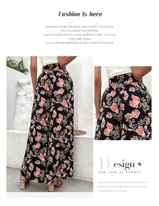 Detail showing elastic high waist and floral pattern on these wide-leg summer pants