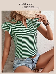 Detail of green and white vertical stripe shirt with ruffle sleeves and V-neckline