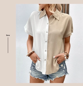 Detail of a short sleeve shirt featuring asymmetric white and khaki color-block and lapel collar
