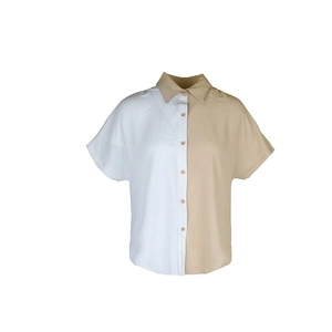 Detail of contrasting panel design and turn-down collar on short sleeve shirt