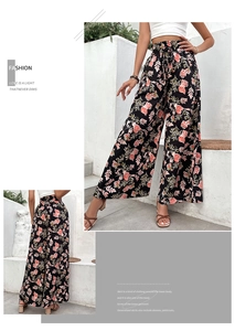 Detail view of high waisted floral wide leg trousers with elastic waist for women