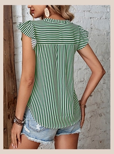 Detail view of the green and white vertical striped ruffle sleeves on a summer V-neck shirt
