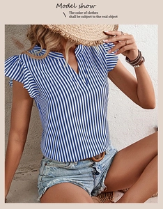 Close-up of blue and white striped summer blouse with ruffle sleeves and V-neckline detail