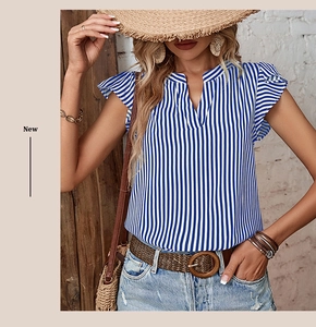 Detailed view of flutter sleeves and blue vertical striped fabric on summer blouse