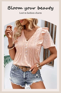 Detail of pink chiffon top with gold foil dots and elegant ruffle short sleeves