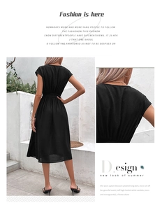Detail view showing the elegant back V-neck and pleated skirt of this black midi dress