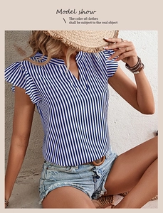 Detail of blue and white striped summer top featuring ruffled sleeves and a V-neckline