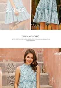 Detail of blue floral halter dress showing tiered pleats and ruffled high neckline