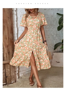 Detailed view of summer floral V-neck dress with button placket and tiered ruffle hem