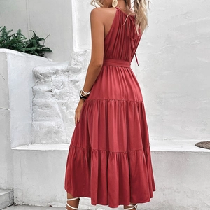Elegant deep red halter neck tiered maxi dress with an open back and bow tie details