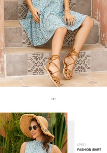 Detail of floral pleated dress with ruffle hem and vintage sandals on stone steps