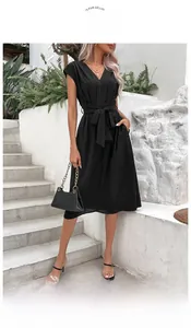 Close-up of black V-neck dress featuring a waist tie and high-quality chiffon texture