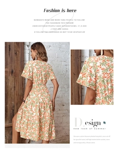 Detail of floral puff sleeves and layered pleated hem on a white summer midi dress