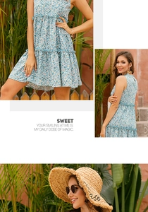 Detail view of a blue floral tiered mini dress featuring daisy prints and ruffled hem