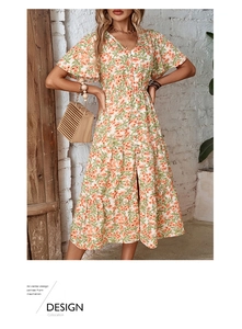 Detail view of floral V-neck midi dress with tiered skirt layers and button front design