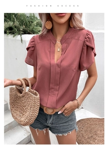 Close-up of V-neck rose red chiffon blouse with layered ruffle sleeves for women
