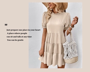 Detail of ruffled round neck and tiered beige sun dress for summer vacation style