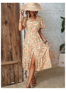 Detail of summer V-neck floral midi dress with button closure and front slit design
