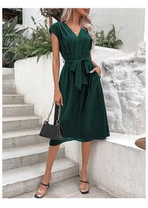 Detail of elegant V-neck dark green midi dress with adjustable waist tie and sleeveless cut