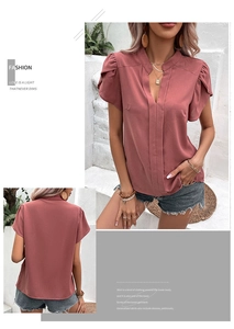 Detail of pink V-neck chiffon shirt with ruffle sleeves and elegant standing collar