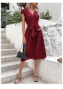 Detail of V-neck wine red midi dress featuring cap sleeves and a matching waist tie belt
