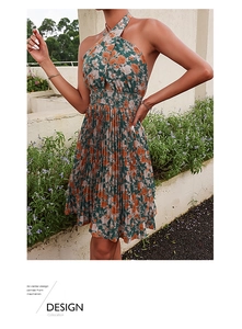 Detail view of floral halter dress featuring elastic pleated waist and ruffled neckline