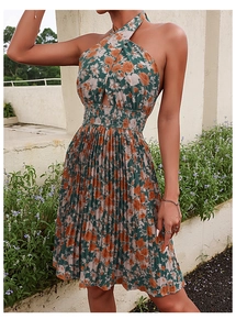 Detail of floral halter neck dress featuring cross-neck design and pleated waist smocking