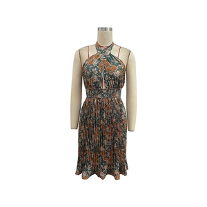 Detail of the halter neckline and cutout on this floral pleated summer dress