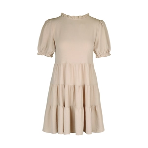 Detail of ruffled stand collar and puff sleeves on a beige tiered summer dress