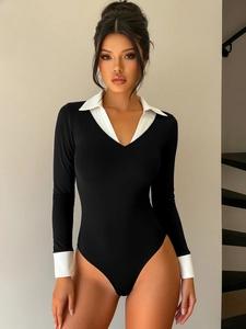 Detail of black and white contrast long sleeve bodysuit with polo collar and slim fit cut