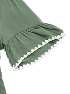 Detail of sage green ruffled sleeve cuff with white crochet lace trim for summer dress