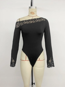 Detail of elegant black lace trimming on asymmetrical neckline of long sleeve bodysuit