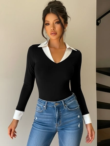 Close-up of contrast collar patchwork and slim fit design on black long sleeve bodysuit