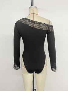 Detailed back view of a black bodysuit featuring elegant floral lace on the shoulder and cuff