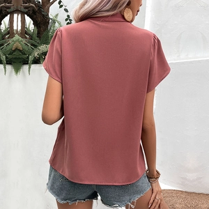 Back view of women's dusty pink short sleeve chiffon shirt with V-neck and loose fit