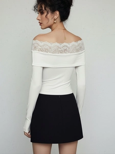 Back view of elegant white off-shoulder bodysuit with delicate lace trim and long sleeves