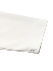 Detail shot of white ribbed knit sleeve cuffs with fine vertical texture and neat stitching