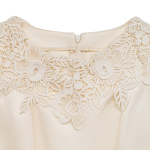 Detail of lace floral neckline and hidden zipper on cream satin jumpsuit bodice