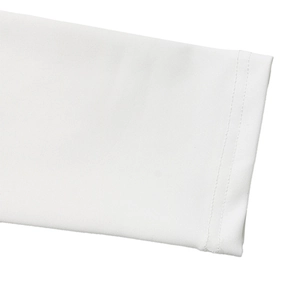 Detail shot of white ribbed knit fabric with precise double-needle flat seam stitching