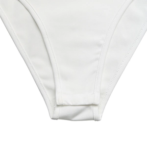 Close-up of secure snap button closure and ribbed knit fabric on white lace bodysuit