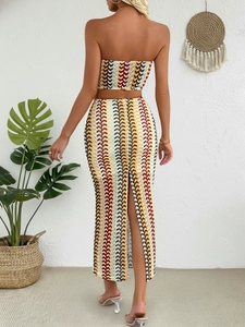 Detailed back view of a colorful striped crochet two-piece set with a slit skirt