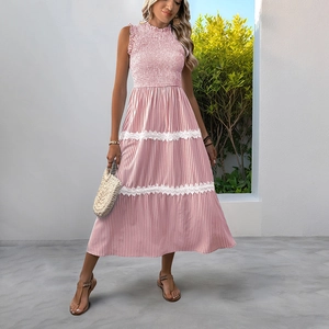 Detail of smocked bodice and lace trim on pink and white striped summer dress