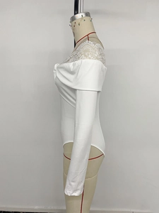 Detail of elegant white long sleeve bodysuit with lace splicing and front twist knot design