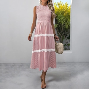 Detail of pink striped smocked maxi dress with white lace inserts and ruffled collar