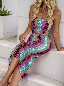 Detail of colorful striped crochet two-piece set featuring wave patterns and knit texture
