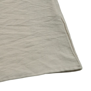 Detail of the light beige pleated fabric texture with neat stitching and breathable feel