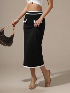 Detail of high waist pencil skirt featuring white contrast stripes and decorative pockets