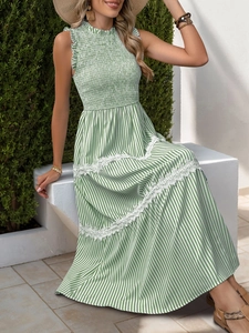 Detail of green striped dress featuring lace splicing and bohemian ruffled neckline