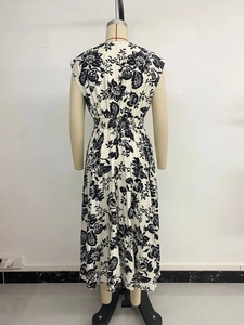 Detailed back view of sleeveless floral maxi dress featuring smocked elastic waist detail
