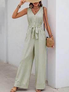 Detail of green and white striped sleeveless jumpsuit featuring V-neck and waist tie